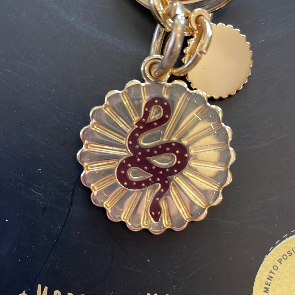 Fossil Key ring gold finish with snake. NWT engraved on back with “Sharon”